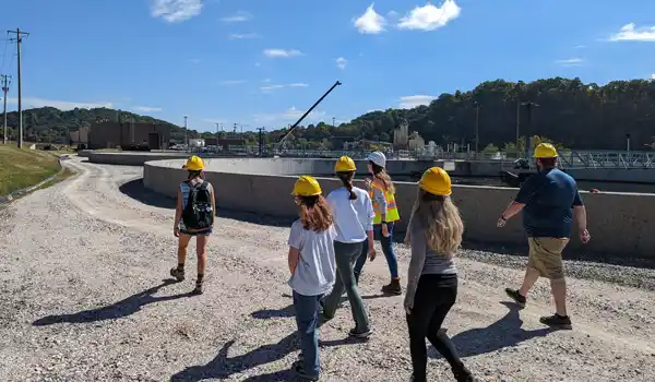 Students walk through a water treatment plant