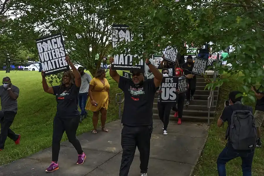 Black Voters Matter demonstrators march during a voting rights rally on June 19, 2021, in Jackson, Miss. Joshua Lott/The Washington Post via Getty Images, Image from article in The Conversation