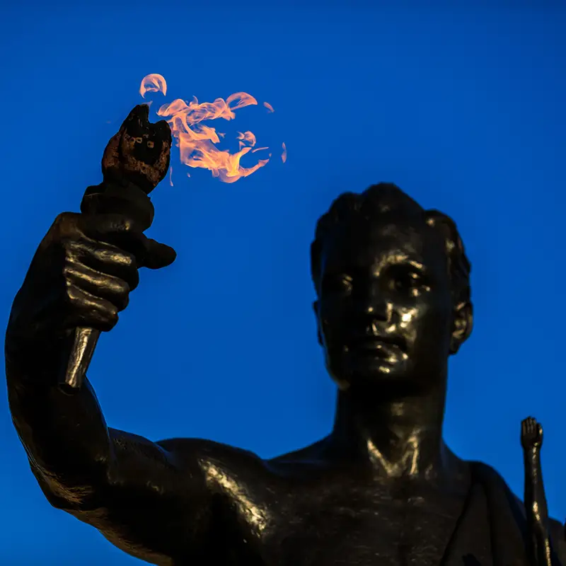 Torchbearer holds his torch high in Circle Park on the evening of April 02, 2020. Photo by Steven Bridges/University of Tennessee